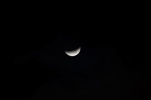 The moon with a partial lunar eclipse, taken in the Swiss mountains, Switzerland, Europe