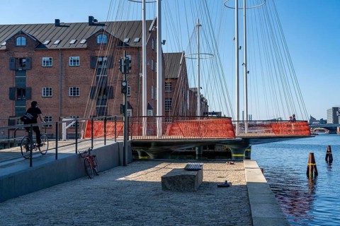 Cyclists on the Cirkelbroen cycle and pedestrian bridge, over the harbour, in the Christianshavens