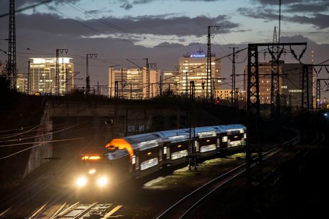 Skyline of Essen city centre, railway facilities in front of the main station, regional train,