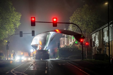 Transport of a 68 metre long, 22 tonne blade of a wind turbine, here in Breckerfeld, with a