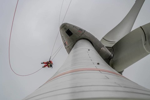 Height rescuers from the Oberhausen fire brigade practise abseiling from a wind turbine from a