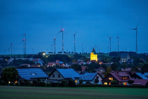 Wind farm above the village of Lichtenau, self-proclaimed energy town, houses with photovoltaic