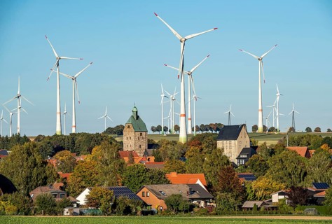 Wind farm above the village of Lichtenau, self-proclaimed energy town, houses with photovoltaic