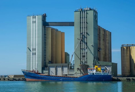 Loading of grain from silo to ship in Ystad harbour, Skåne County, Baltic Sea, Sweden, Scandinavia,