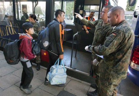 Syrian refugees arrive at Schönefeld station on a special train. They are then taken by bus to