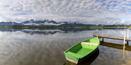 Rowing boat at sunrise, Hopfensee, Hopfen am See, near Füssen, Ostallgäu, Allgäu, Bavaria, Germany,
