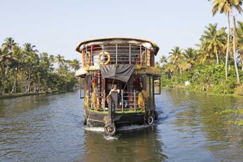 Traditional houseboat on a canal in the canal system of the backwaters, Kerala, India, Asia