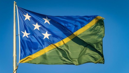 The flag of Solomon Islands, Solomon Islands, island nation in the South Seas, flutters in the