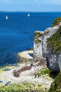 People on paddleboards, White Cliffs. Old Harry Rocks Jurassic Coast, Dorset Coast, Poole, England,