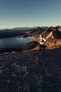 Trail running in autumn on the Jochberg on Lake Walchensee against the wonderful backdrop of the