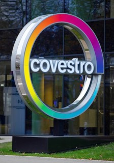 Covestro AG, company logo in front of the corporate headquarters at dusk, Leverkusen, Bergisches