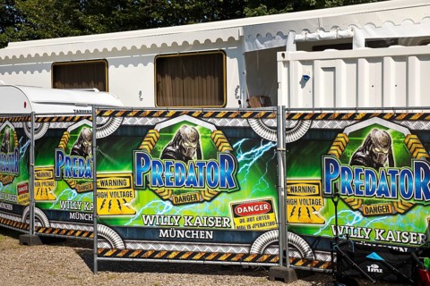 Temporary home of the showmen behind posters on the site fence, privacy, Cranger Kirmes, Herne,