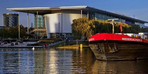 Mittelland Canal with barge Niedersachsen 21 and Autostadt, Wolfsburg, Lower Saxony, Germany,