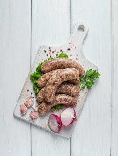 Raw kupaty, traditional Georgian sausages, raw sausages, with spices and herbs, Georgian cuisine