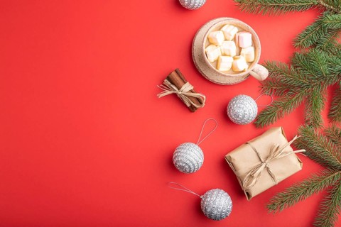 Christmas or New Year composition. Decorations, box, cinnamon, silver balls, fir and spruce