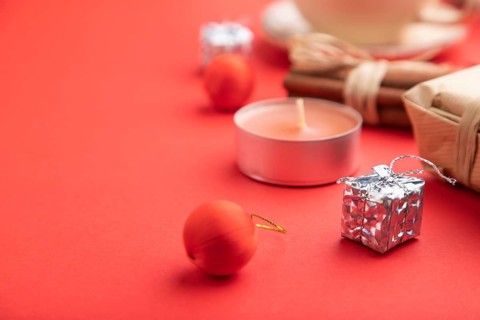 Christmas or New Year composition. Decorations, box, cinnamon, fir and spruce branches, cup of