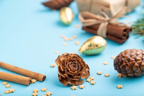 Christmas or New Year composition. Decorations, box, cinnamon, cones, fir and spruce branches, on a
