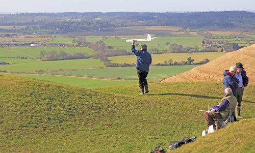 Flying model airplanes from Roundway Down, North Wessex Downs, Wiltshire, England, UK
