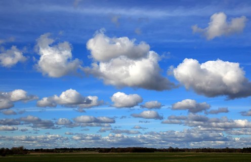 (Cumulus) clouds in blue sky over Bawdsey and Alderton, Suffolk, England, UK