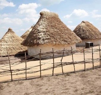 Buildings of replica Neolithic huts at the Stonehenge site, Wiltshire, England, UK