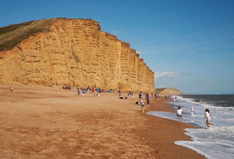Sandstone cliffs and beach West Bay, Bridport, Dorset, England, UK