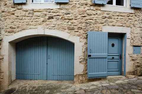 Door and gate on a house in La Roque-sur-Cèze, Département Gard, Occitanie region, France, Europe