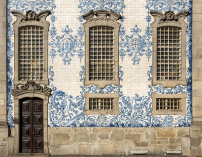 The facade of Igreja do Carmo church, adorned with intricate blue and white tiles, Porto, Portugal,