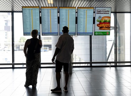 Info screens for departures, arrivals at Amsterdam Schiphol Airport, Terminal, Netherlands