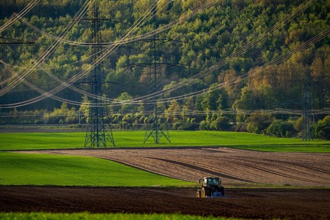 Tractor working a field near Grevenbroich, in spring, Germany, Europe