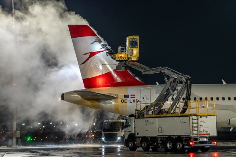 Winter at Frankfurt Main Airport, FRA, Austrian aircraft being de-iced by de-icing vehicles, Hesse,
