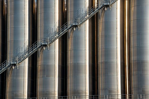 Stainless steel tanks of a large silo facility in Duisburg inland harbour, Duisburg-Neuenkamp, for