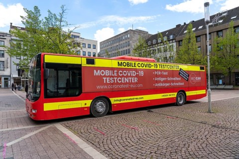 Mobile test centre for Corona rapid tests, in a bus, in the city centre of Bochum, North