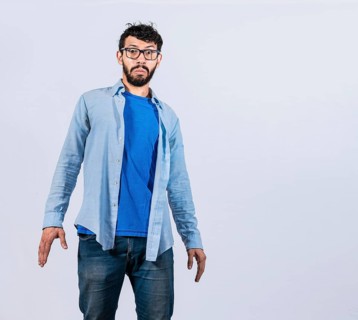 Surprised bearded man looking into the camera isolated. amazed and discovered young man looking at