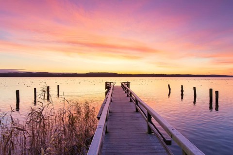 Jetty at sunrise at Lake Ratzeburg, Ratzeburger See at Lauenburg Lakes Nature Park, Naturpark