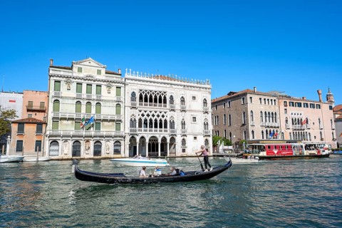 Gondolier with gondola on the Grand Canal, Venice, Veneto, Italy, Europe