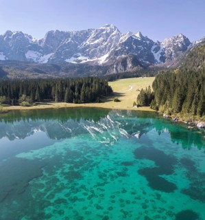 Aerial view of Lake Fusine and the Mangart mountain range, Tarvisio, province of Udine, Italy,