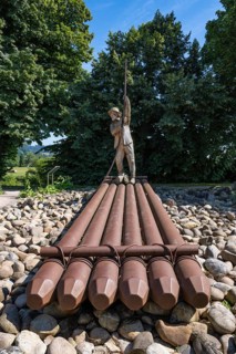 Sculpture of a raftsman at the rafting museum, transport museum, sight in the old town centre of
