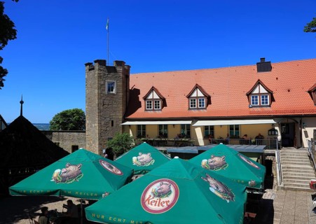 Sunshades of the beer garden on the castle ruins on the Schlossberg, Königsberg in Bavaria,