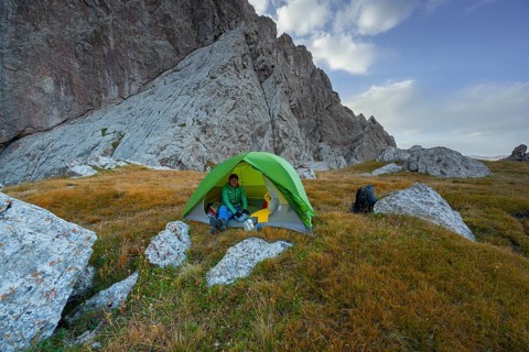 Wild camping, camping in the wilderness with a tent, Kol Suu mountain lake, Sary Beles Mountains,