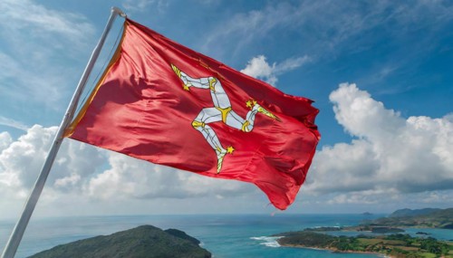 The flag of the Isle of Man, Great Britain, flutters in the wind