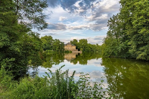 Monrepos Lake Castle reflected in Lake Eglosheim, Ludwigsburg, Baden-Württemberg, Germany, Europe
