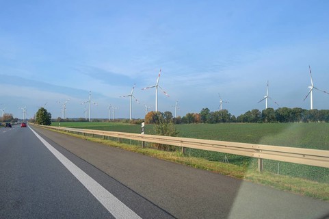 Wind turbines on the motorway. A9 motorway, Thuringia, Germany, Europe