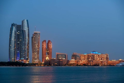 Skyline at dusk, Etihad Towers and Emirates Palace Hotel, Abu Dhabi, Emirate of Abu Dhabi, United