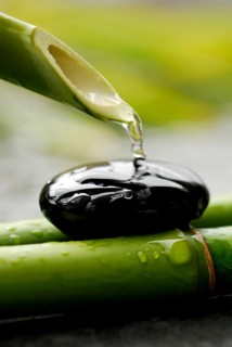 Water flows from bamboo cane, stone
