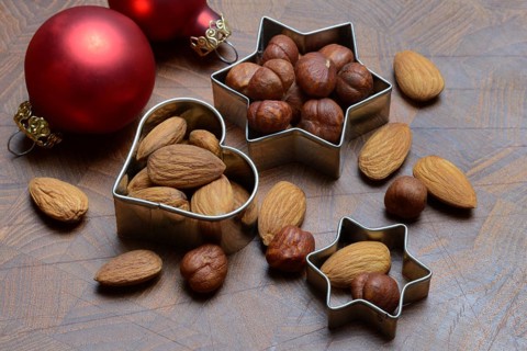 Nuts and cookie cutters, almonds and hazelnuts