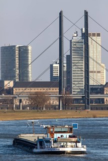 Düsseldorf, city centre skyline, skyscrapers, Rheinkniebrücke, Rhine, cargo ship