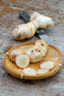 Ginger ( Zingiber officinale) freshly harvested, roots, root, knife