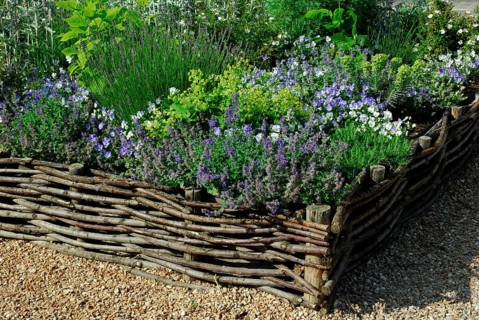 Flowerbed with willow fence