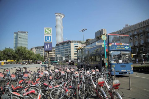 City Tour Sightseeing Bus at Main Station with parking space for bicycles, rental bikes, disorder,