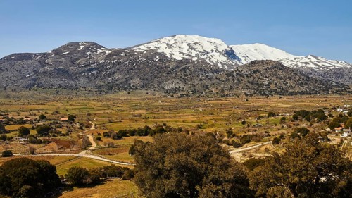 Katharo plateau, fields, trees, snow-capped mountains, Lassithi, East Crete, island of Crete,